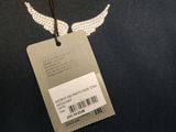 the back of a black shirt with a tag with a white angel on it