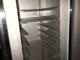 an empty refrigerator with a lot of shelves inside of it