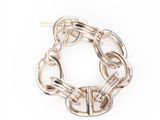 a close up of a chain bracelet on a white background