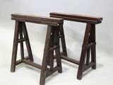 two wooden benches sitting next to each other on a white surface