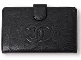 a chanel black leather wallet with a logo on the front