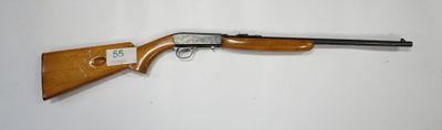 a rifle that is laying on top of a table