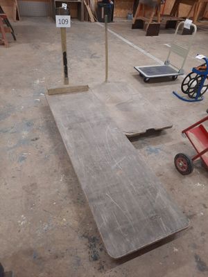 several pieces of wood are sitting on the floor of a building
