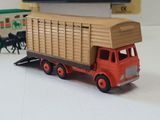 a toy truck with a trailer on a table