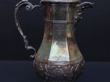 antique silverplated coffee pot with lion handles