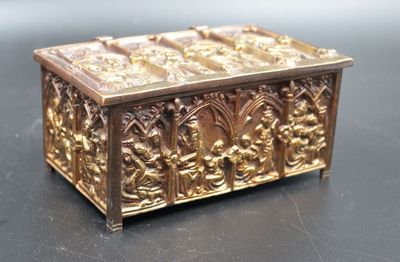a gold box that is sitting on a table
