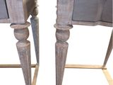 pair of wooden side tables with drawers on each side of them