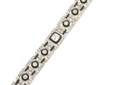 a close up of a silver bracelet with black and white beads