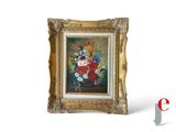 a picture of a painting of flowers in a gold frame