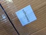 a cardboard box with a sticker on it sitting on a table