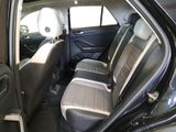 the back seats of a car are empty and the passenger seat is empty