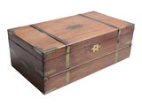 a small wooden box with a metal latch on it