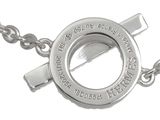a silver necklace with a cross on it on a white background