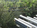 a bunch of pipes that are sitting in the grass