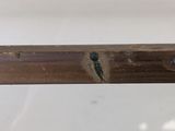 a piece of wood that has been cut off and is sitting on a table
