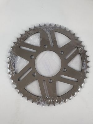 a close up of a motorcycle sprocking gear on a white surface