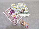 several pieces of cloth are laid out on a gray surface