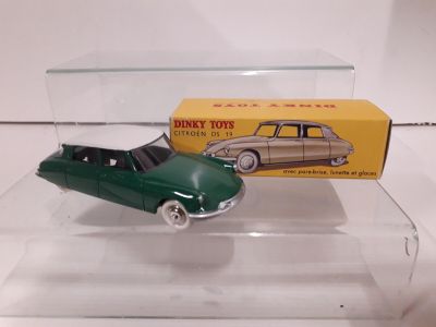 an image of a green toy car in a clear box