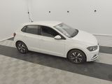 the white car is parked in the garage on the checkered floor