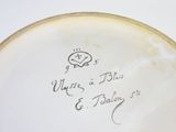 a close up of a plate with writing on it