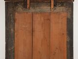 an old wooden window with a wooden frame and wooden shutters