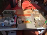 a table with many boxes of items on it