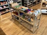 a metal cart with various items on it in a store