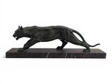 a statue of a black panther on a marble base
