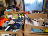 two boxes of clothes and other items in a room