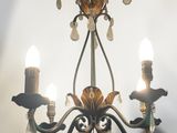 a small chandelier with three lights hanging from it