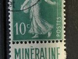 an old stamp with a picture of a woman on it