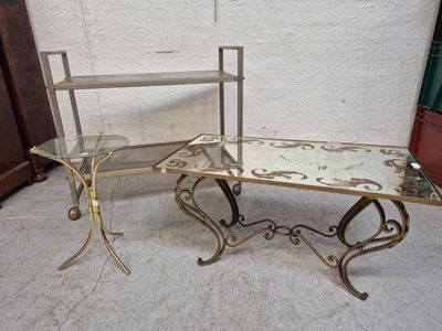 a glass table and a metal table with a mirror on it