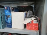many boxes and boxes on a shelf in a room
