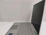 an open laptop computer sitting on top of a white table