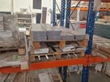 many pallets of wood in a warehouse with pallets on them