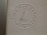 a white book with a picture of a bird on it