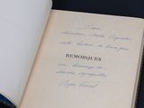 an open book with writing on it sitting on a table
