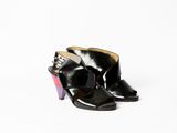 black leather ankle boots with multi - colored heels on a white background