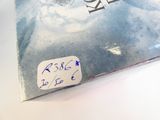 a book with a sticker on it sitting on a table