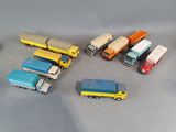 a lot of toy trucks that are sitting on a table