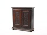 a wooden cabinet that has a door on top of it