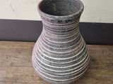 a vase that is sitting on a wooden table