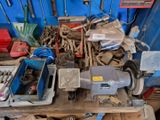 many tools on a workbench in a garage