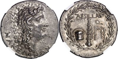 a silver coin with an image of a woman on it