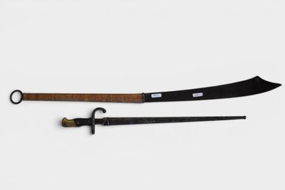 two swords with a wooden handle and a black handle