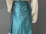 an image of a mannequin wearing a skirt and blouse