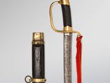 an image of a sword and a dagger with a red handle