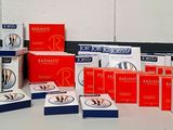 several boxes of condoms are sitting on a table in front of a white wall