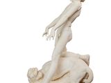 statue of a woman on a rock with a dog in the foreground