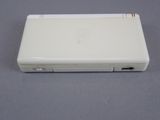 the back of a white nintendo wii game console sitting on top of a table